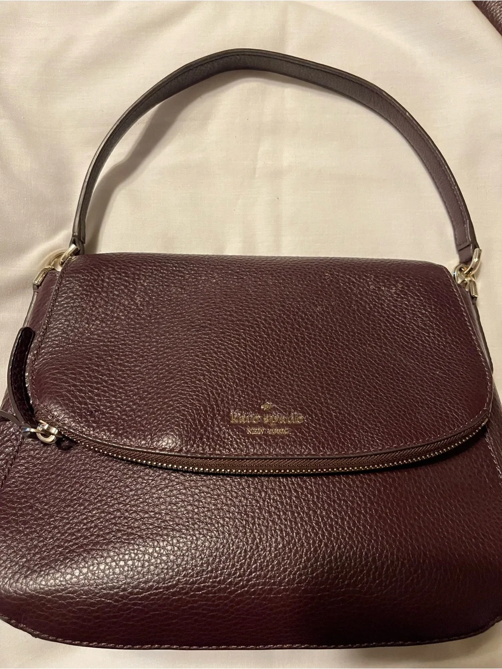 kate spade Pebble Leather Shoulder Bag with matching wallet in Deep Burgundy.